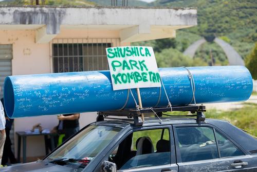 Pipe with signings on the roof of a car