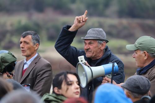 Angry man protests against river destruction